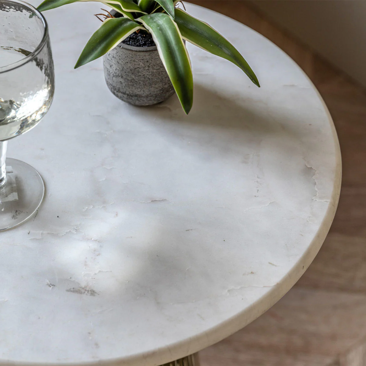 green and white glass and marble side table