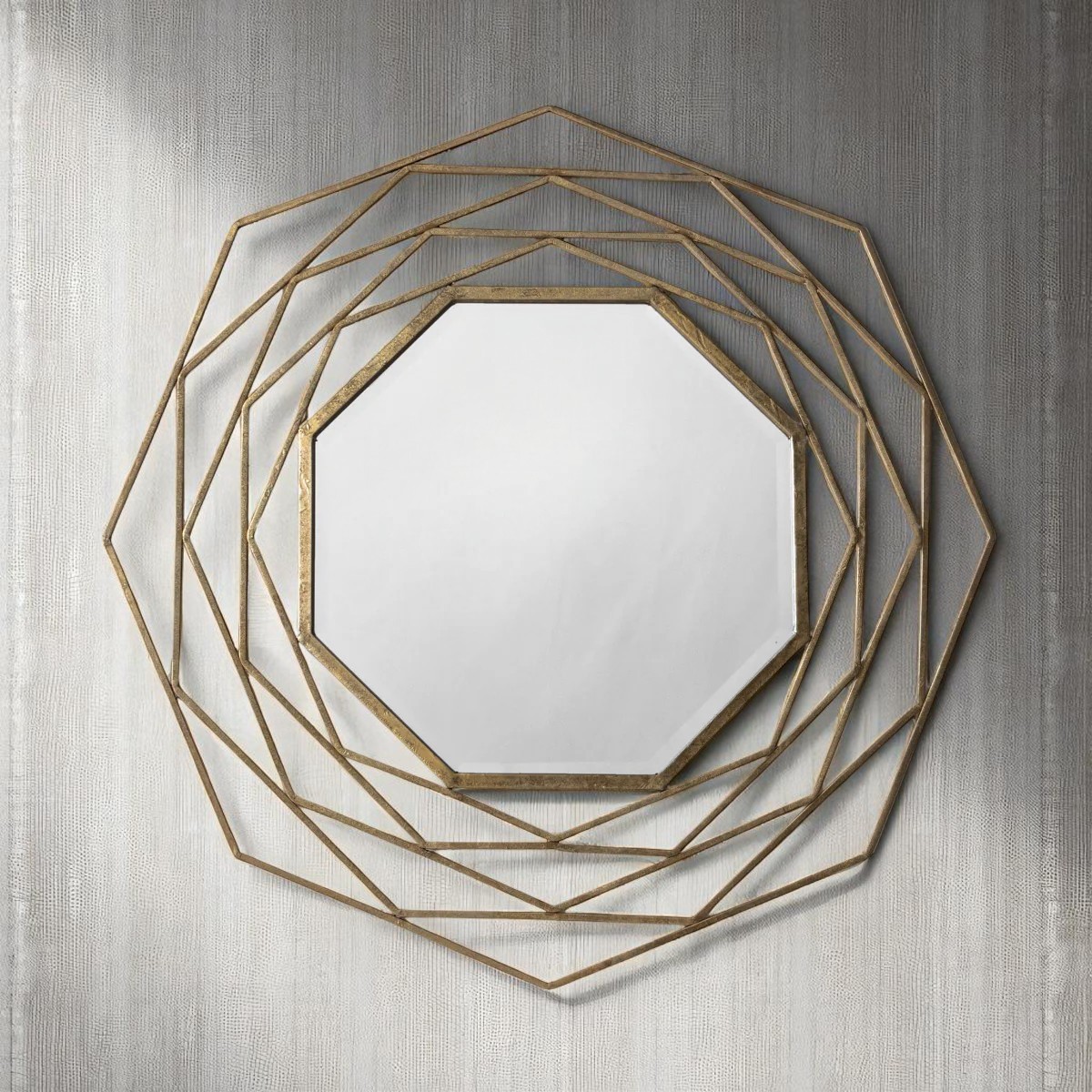 Octagonal wall mirror with gold metal frame and bevelled glass