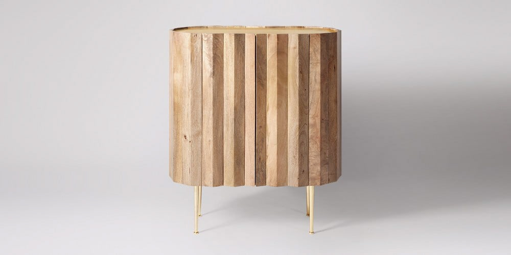Swoon Editions cabinet in light mango wood.