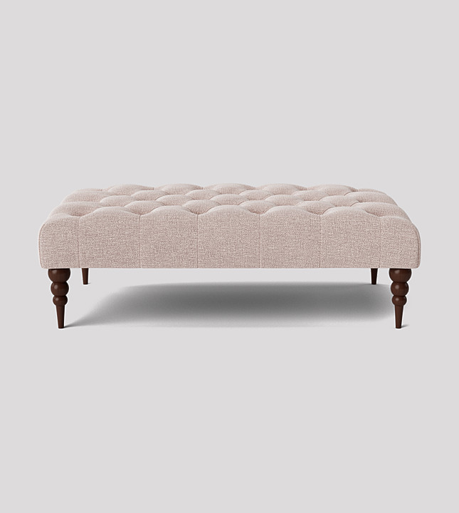 Swoon footstool upholstered in blush house weave and dark oak turned legs