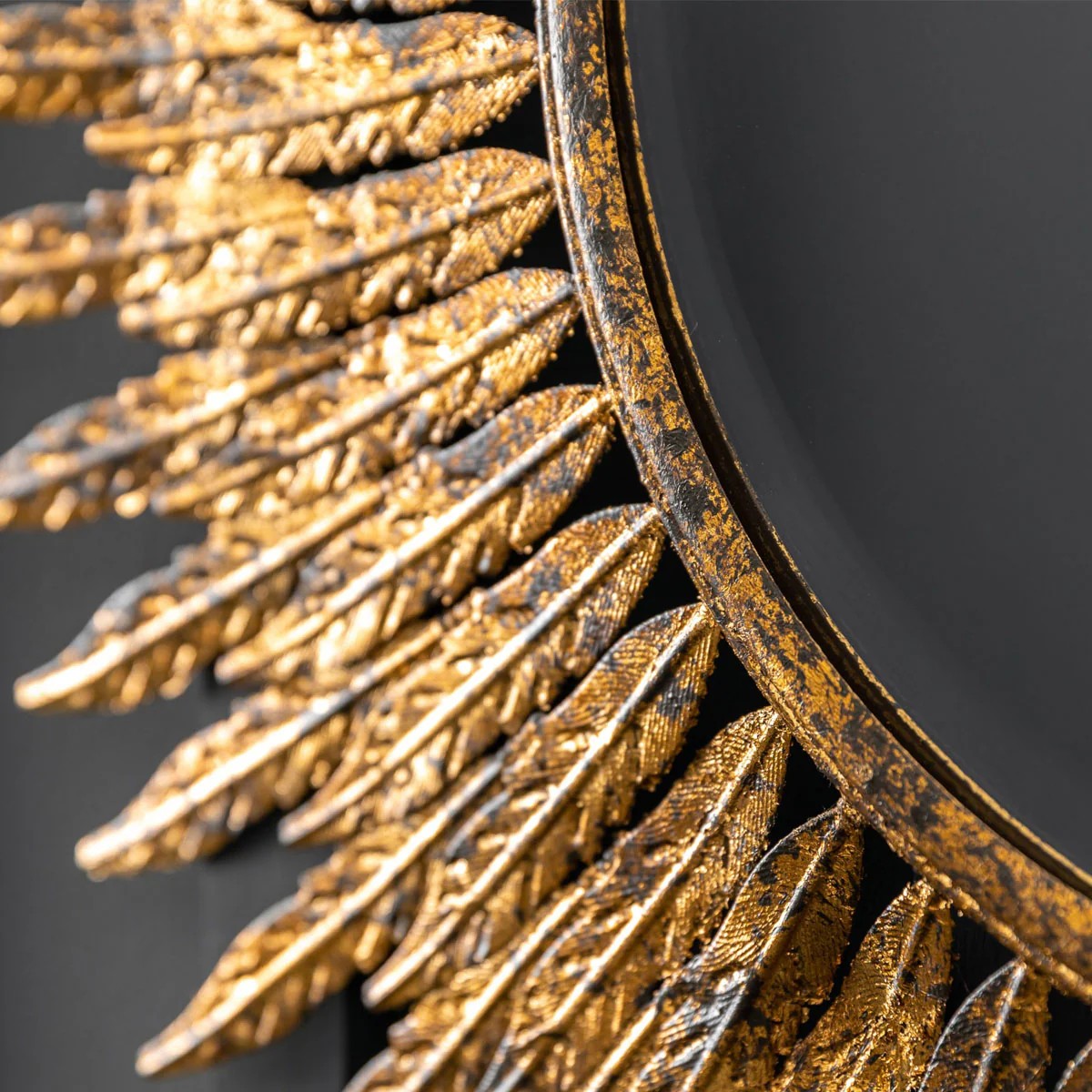 Ornate wall hanging mirror with aged gold finish