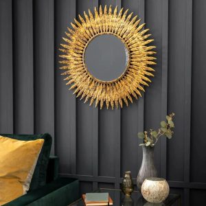 Ornate wall hanging mirror with aged gold finish