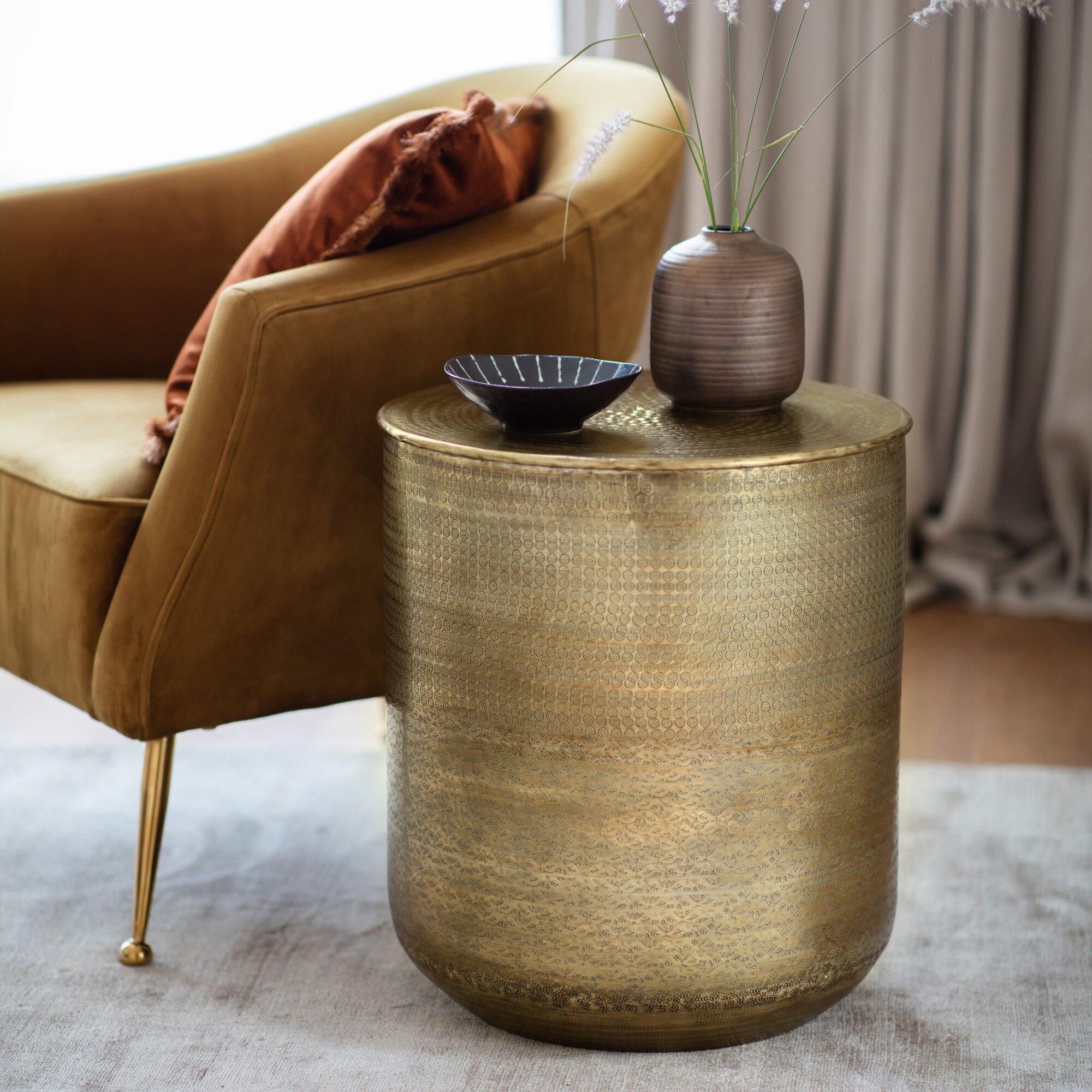 embossed round metal side table antique brass finish